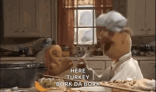 a muppet is cooking a turkey in a kitchen and says here turkey bork da bork