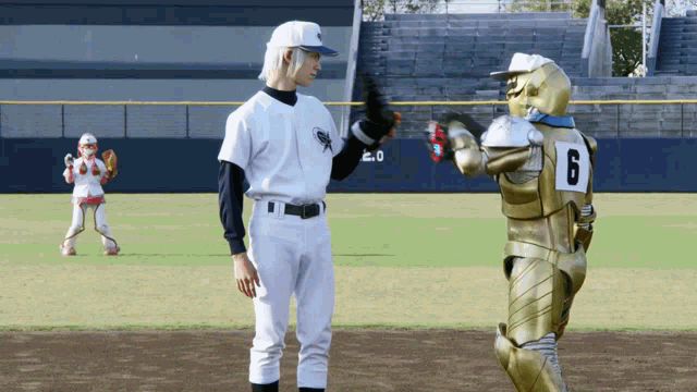 a baseball player with the number 6 on his back talks to another player