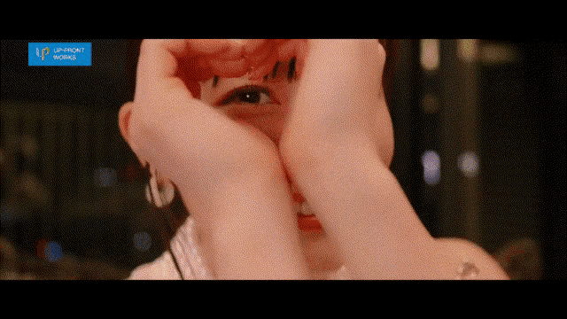 a woman covering her face with her hands with a blue banner that says vip front works