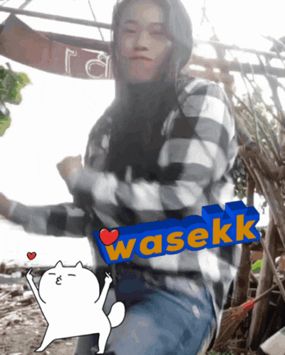 a woman dancing in front of a sign that says wasekk