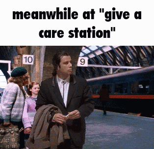 meanwhile at " give a care station " a man in a suit is standing in front of a train