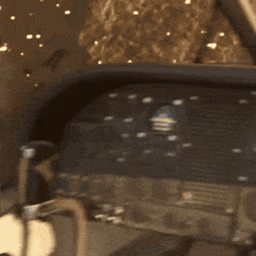 a person sitting in a car with a steering wheel in front of them