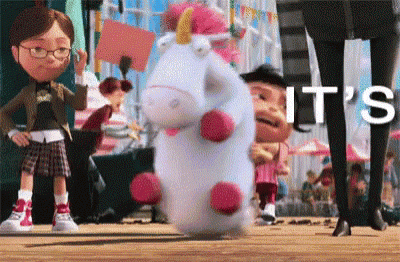 a stuffed unicorn from the movie despicable me is standing on the ground