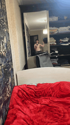 a man takes a picture of himself in a mirror