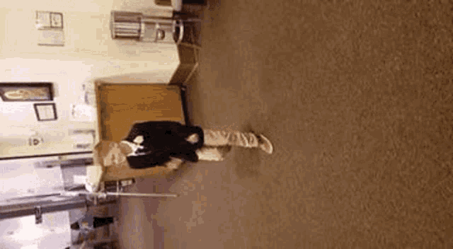 a person is standing in a hallway with a cane .