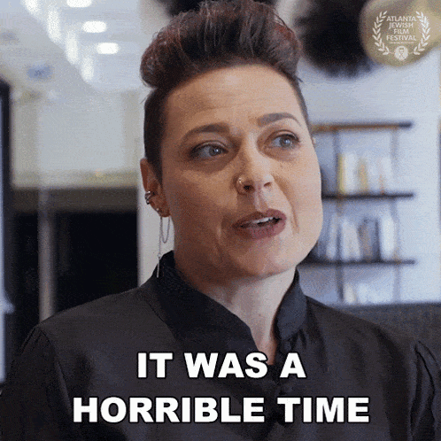 a woman says " it was a horrible time " while wearing a black shirt