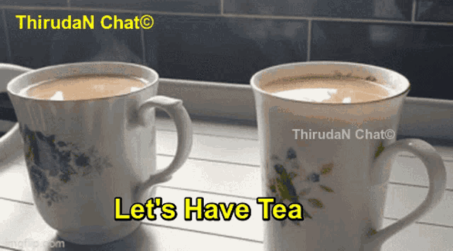 two cups of tea on a table with the words let 's have tea