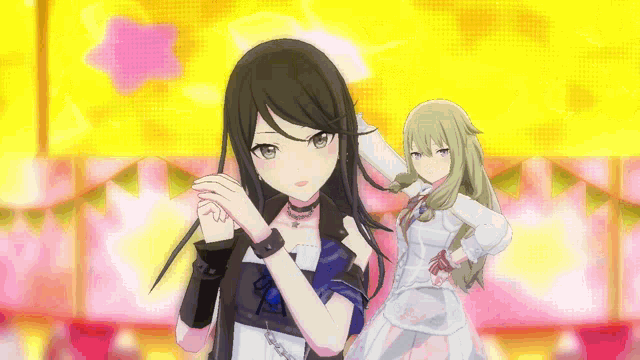 a couple of anime girls standing next to each other on a stage