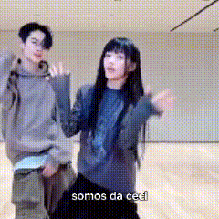 a man and a woman are dancing in a room and the woman says somos da ceol