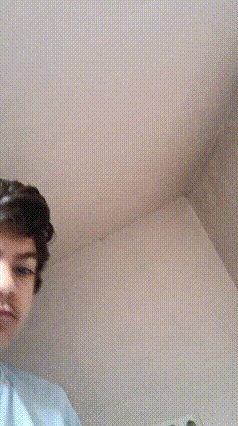 a blurry picture of a young boy making a face