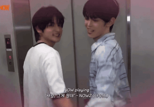 two young men are standing next to each other in an elevator and one of them says now playing