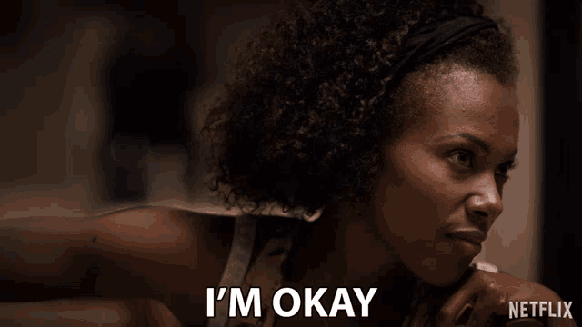 a woman with curly hair says i 'm okay in a netflix ad