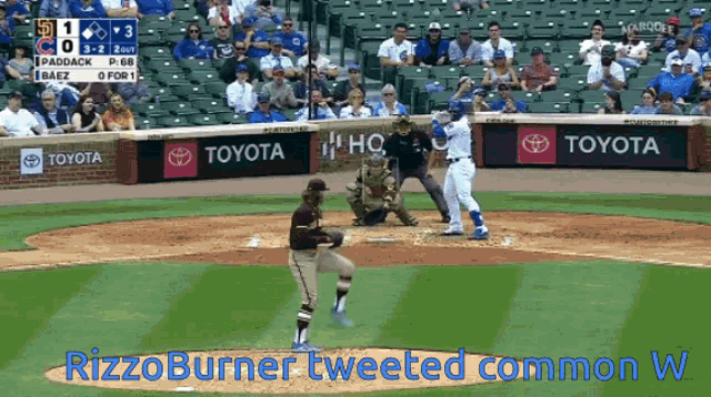 a baseball game is being played with toyota advertisements on the walls