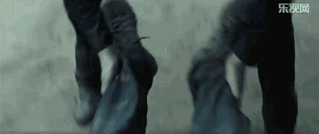 a couple of people standing next to each other in a dark room
