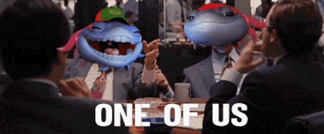 a group of men are sitting around a table with one of them wearing a green hat that says one of us on it