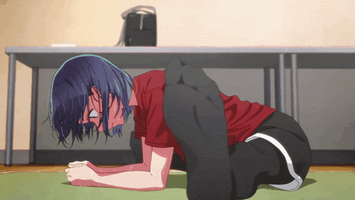 a person laying on their stomach with their legs crossed