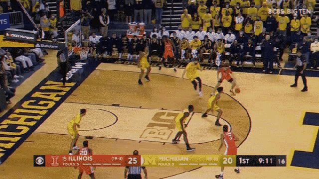 a basketball game between michigan and 15 illinois