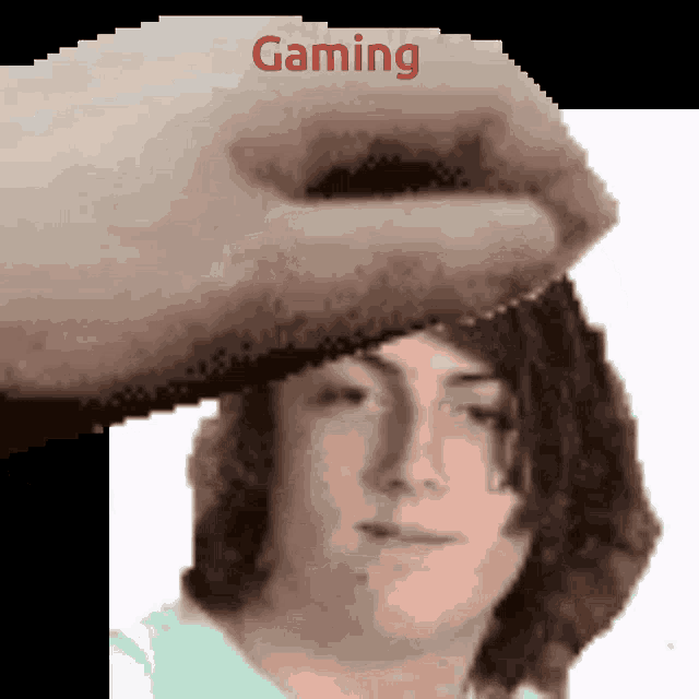a pixelated image of a person 's head with the word gaming written on it