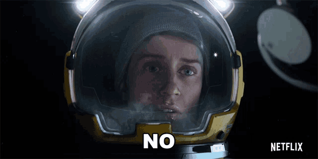 a woman in a space suit with the word no on her face