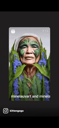 a video of a woman with green paint on her face is titled minelauvart and minela