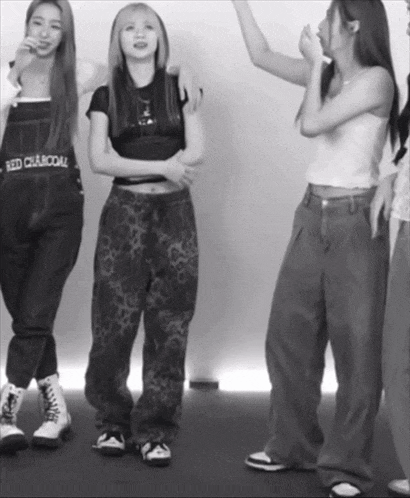 a black and white photo of a woman wearing overalls that says red charcoal