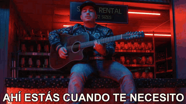 a man playing a guitar in front of a sign that says skat no