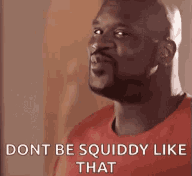 a bald man with a beard is wearing a red shirt and says `` don t be squiddy like that '' .