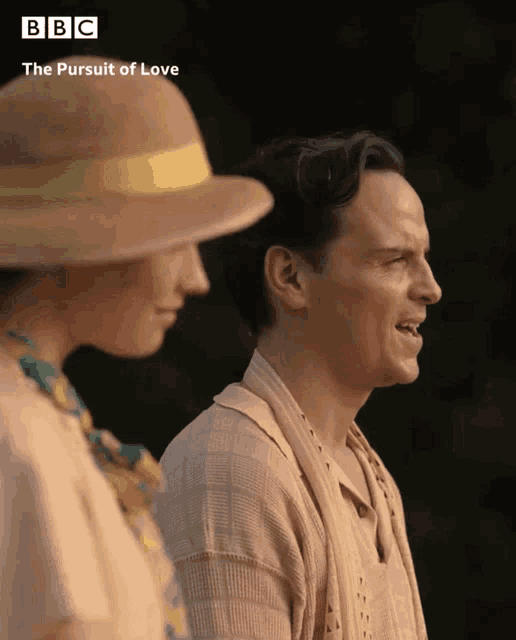 a man and a woman are standing next to each other with bbc written on the bottom right