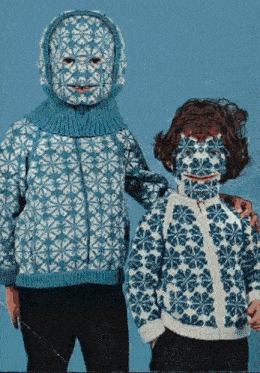 two children wearing blue and white sweaters with face masks on