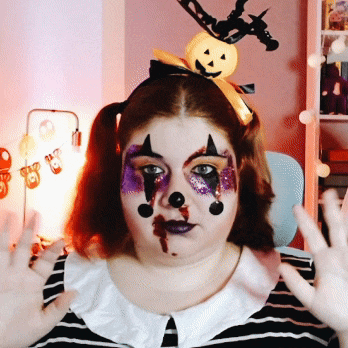 a woman with a pumpkin headband on her head