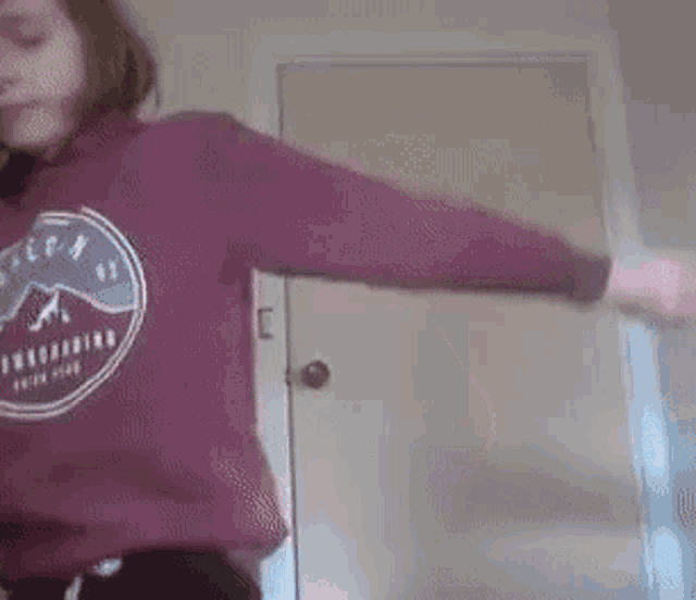 a woman wearing a sweatshirt that says ' freeride ' on it
