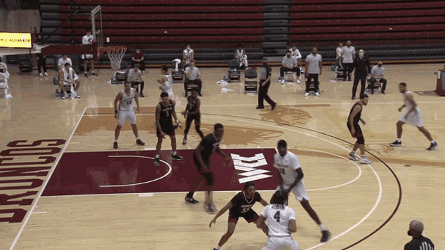 a basketball game is being played on a court that says broncos on it