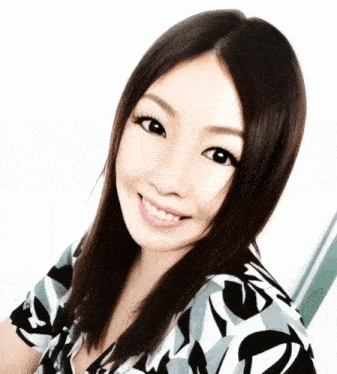 a woman with long black hair is smiling and wearing a floral shirt