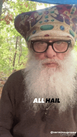 a man with a beard wearing glasses and a hat that says all hail on it