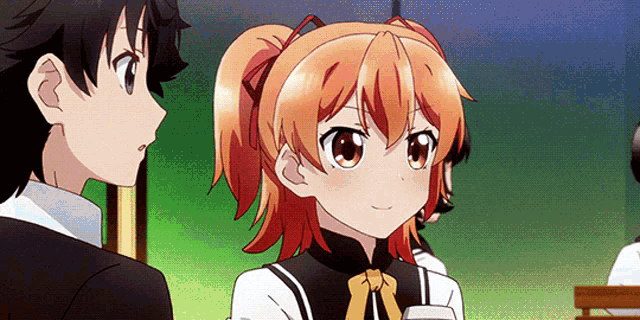 a boy and a girl are looking at each other and the girl has orange hair