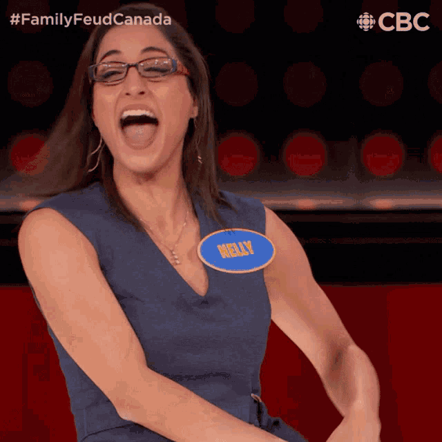 a woman in a blue dress with a name tag that says kelly