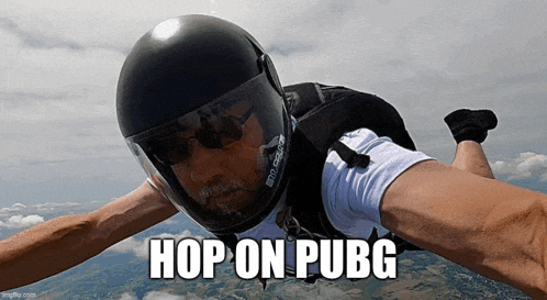 a man wearing a helmet and sunglasses is flying through the air with the words hop on pubg below him