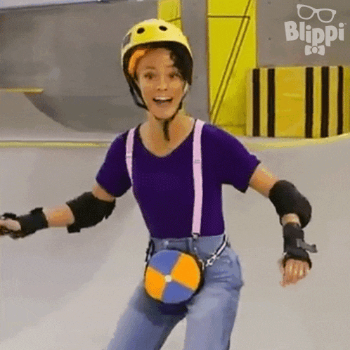 a woman wearing a helmet and suspenders is rollerblading .