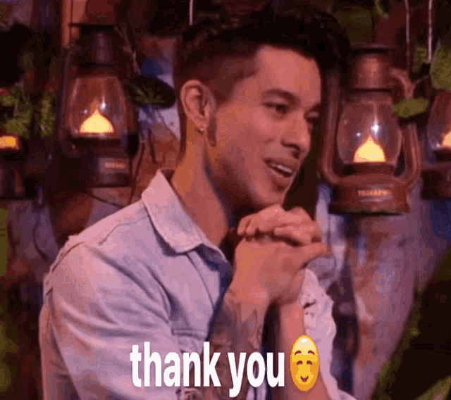 a man in a denim shirt says thank you