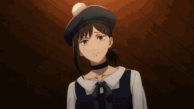 a girl wearing a hat and a choker is waving