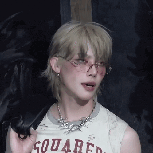 a person wearing sunglasses and a shirt that says squared