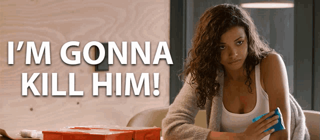 a woman is holding a blue ice pack in front of a sign that says " i 'm gonna kill him " on it