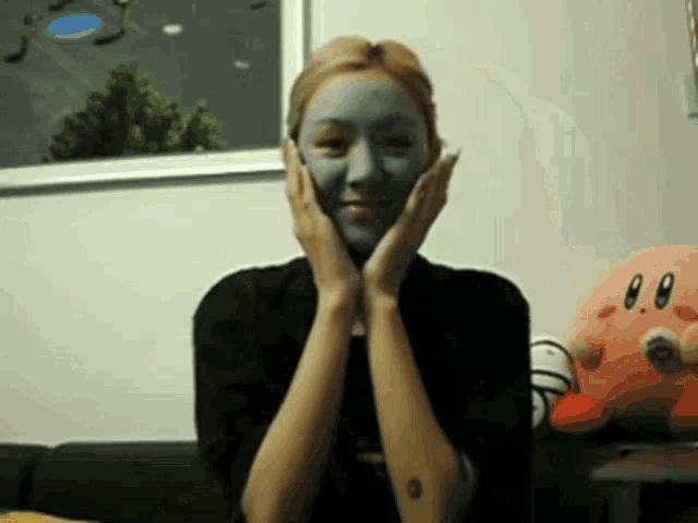 a woman with a mask on her face is smiling