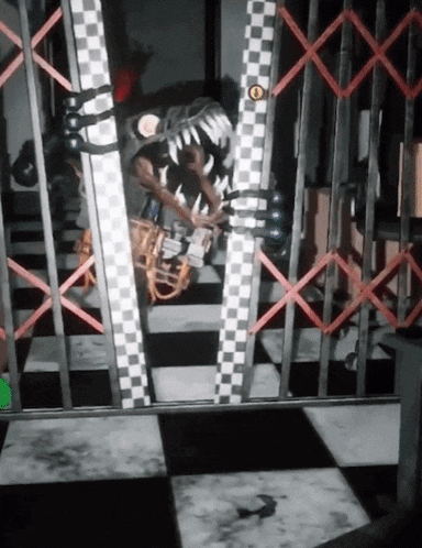 a black and white checkered floor is behind a fence with a yellow circle on it