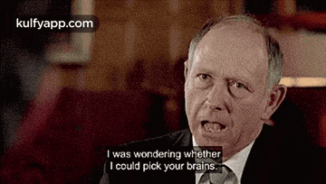 a man in a suit and tie is talking and saying `` i was wondering whether i could pick your brains ''