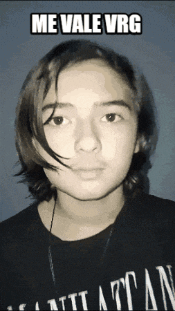 a young man with long hair is wearing a black shirt that says attan on it