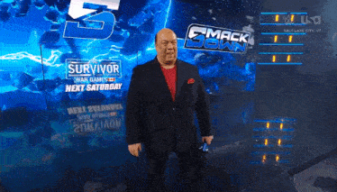 a man in a suit is standing in front of a smack down sign