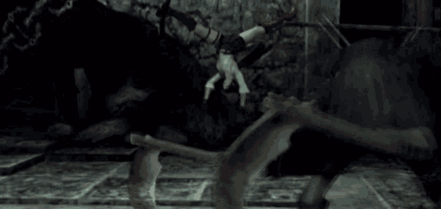 a video game character is doing a handstand in a dark room while fighting a monster .