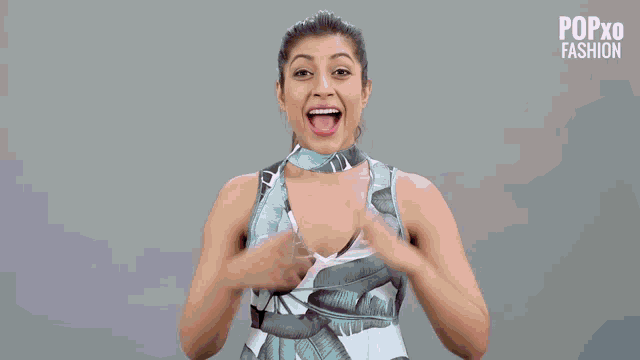 a woman with a red scarf around her neck is wearing a white off the shoulder top