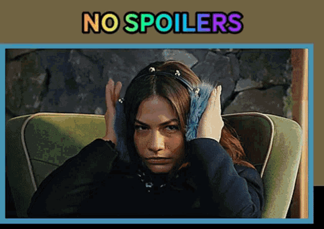 a woman covering her ears with a headband with the words no spoilers written above her
